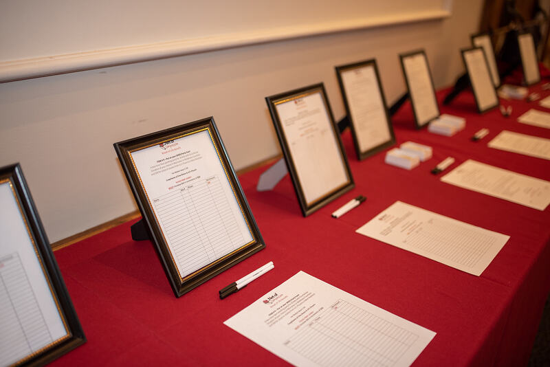 A row of silent auction items at the 2022 Bread of Life Benefit